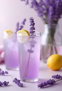 Lavender Lemonade Spritz in glasses garnished with lemon slices and fresh lavender